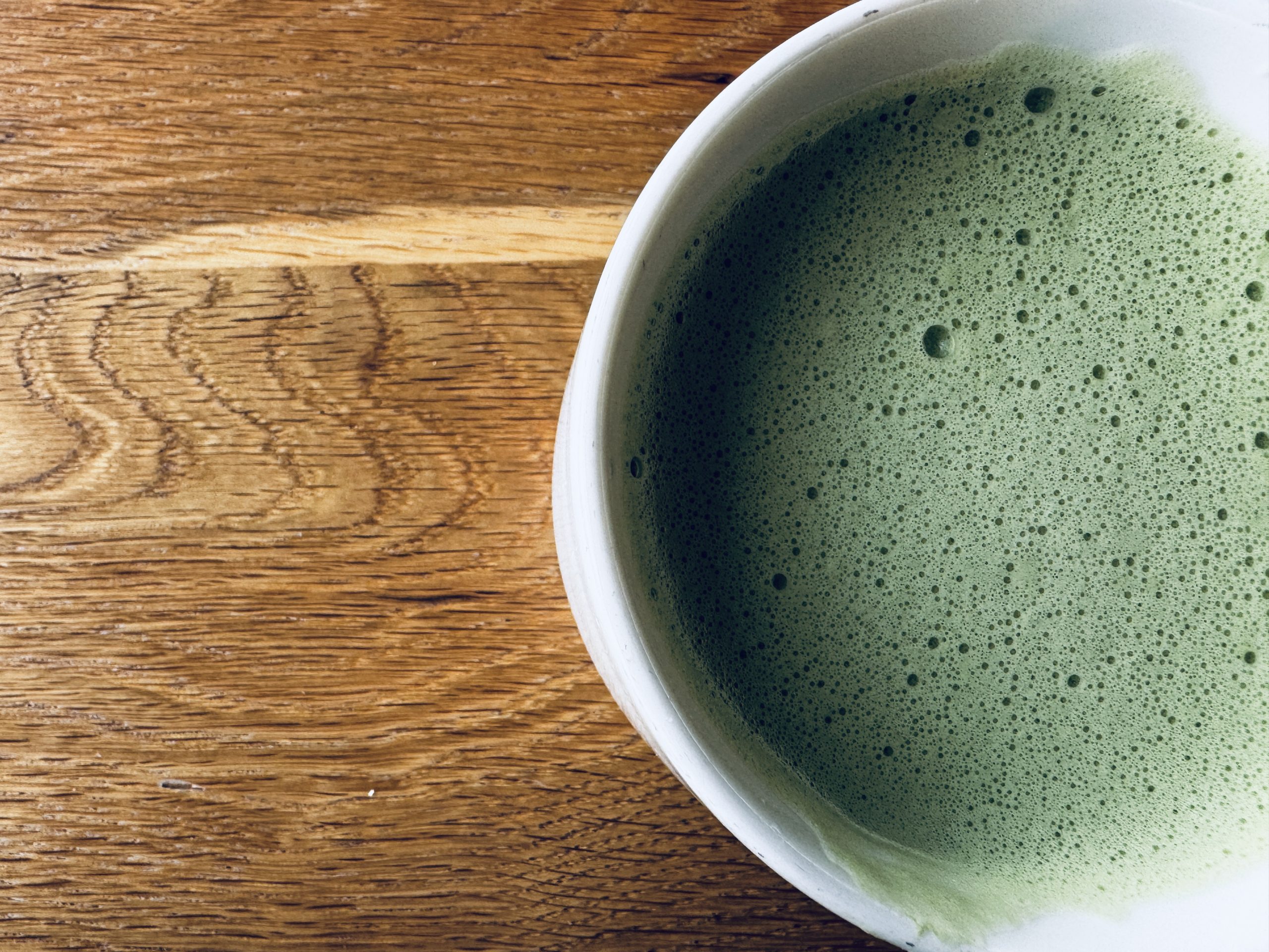 matcha tea atop a wooden table